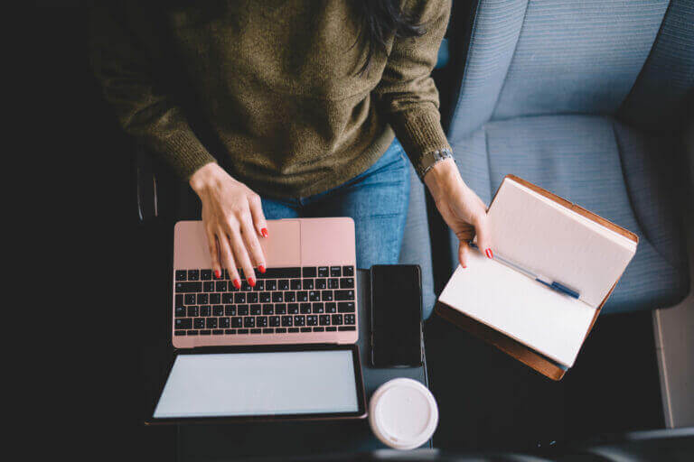 A person researching and jotting down their personal and professional boundaries.