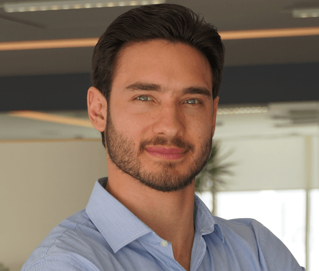 Fernando Wadskier wearing a blue dress shirt.