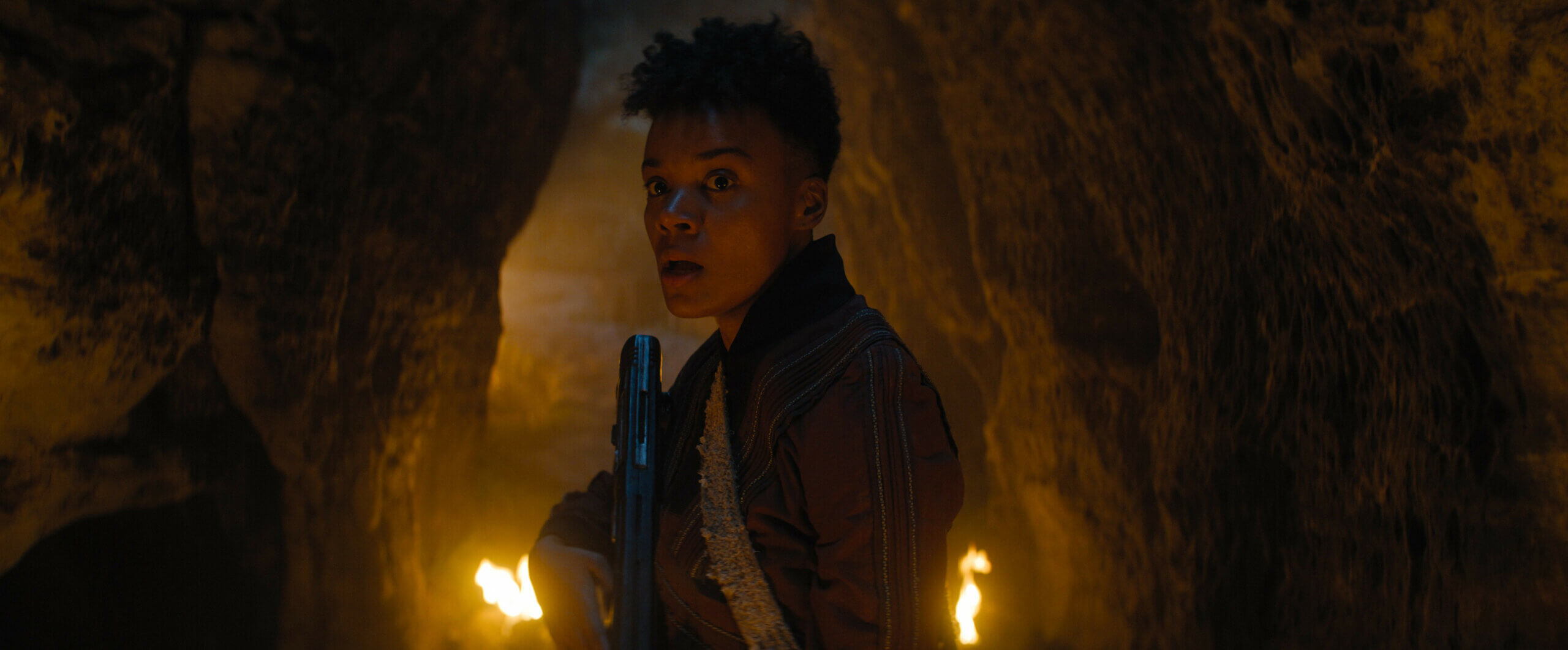 Leah Harvey nervously exploring in a cave.
