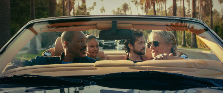 Eddit Murphy, Taylour Paige, Joseph Gordon-Levitt and Bronson Pinchot in a nice car outside.