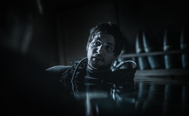 Jack Parr in scuba gear looking distressed.