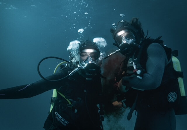 Jack Parr and Kim Spearman in scuba gear for The Last Breath movie.
