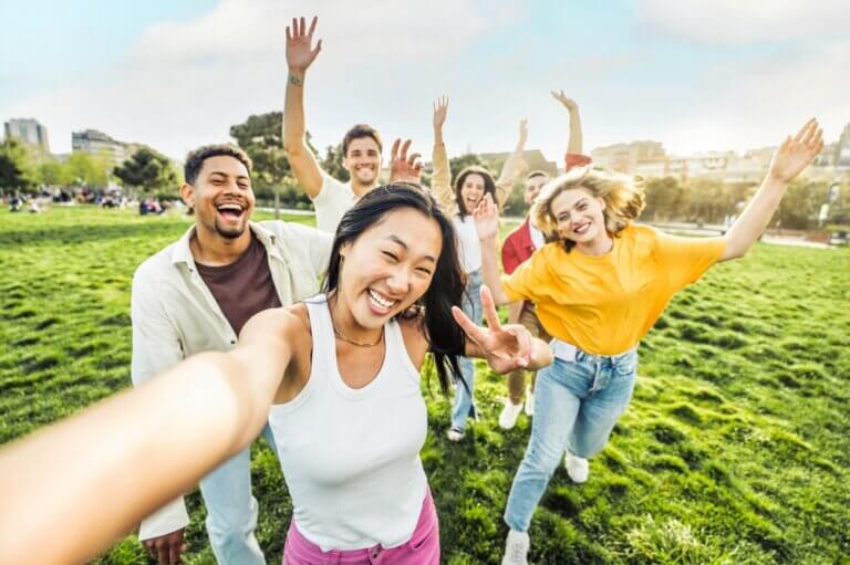 Diverse group of friends having fun and taking a selfie in the summer.