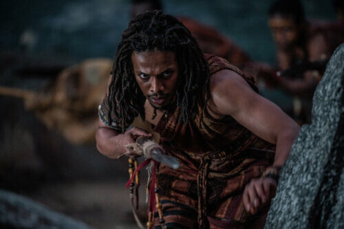 Moe Hashim in Roman robes stalking prey in Peacock's 'For Those About to Die.'