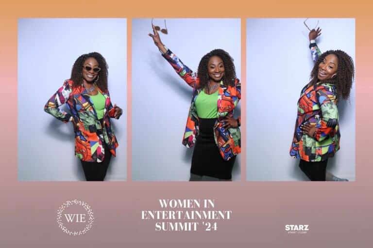 Actor Rosetta Tate taking multiple photo ops in a green shirt, sunglasses and a fun, multicolored jacket.