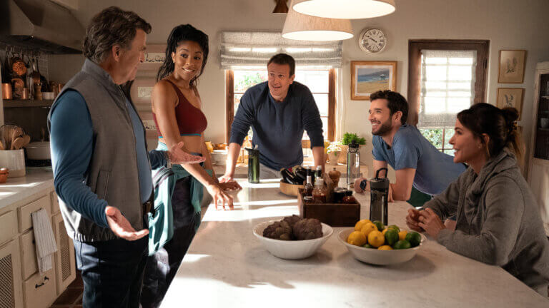 Ted McGinley, Jessica Williams, Jason Segel, Michael Urie and Christa Miller sitting at the dinner table.
