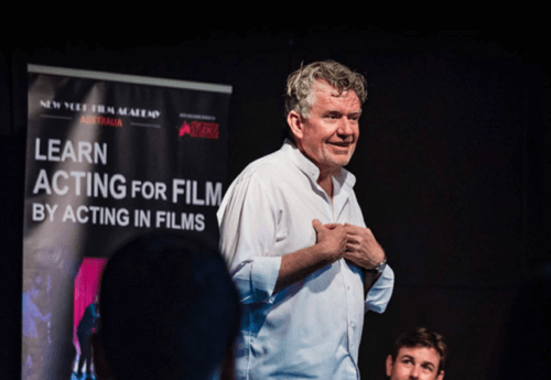 Casting director Gregory Apps onstage teaching an acting class.