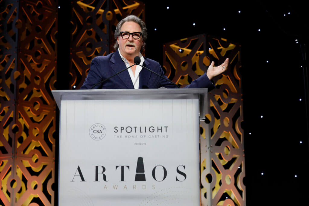 Casting Driector John Papsidera at the 40th Annual Artios Awards podium accepting an award.