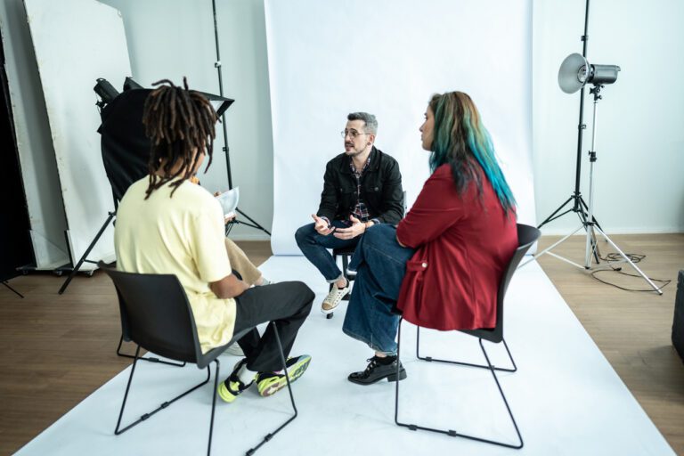 Diverse group of actors sitting in a studio before they go on set.
