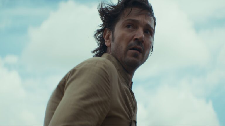 Diego Luna in a tan linen Star Wars outfit looking upset in the show Andor.